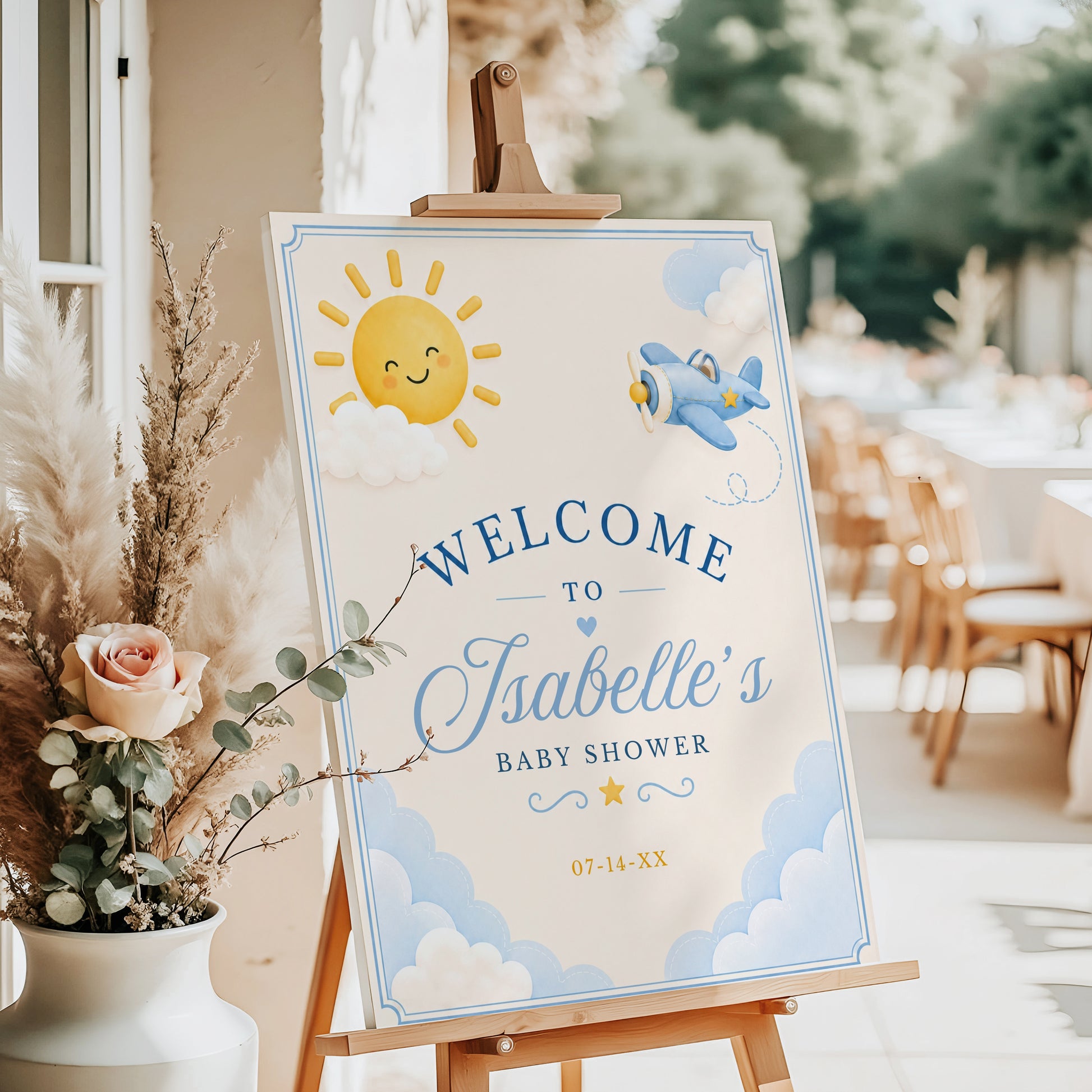 Editable here comes the son baby shower welcome sign Canva template with smiling sun, blue toy airplane, fluffy clouds, arched navy typography, and flowing script on a warm cream background