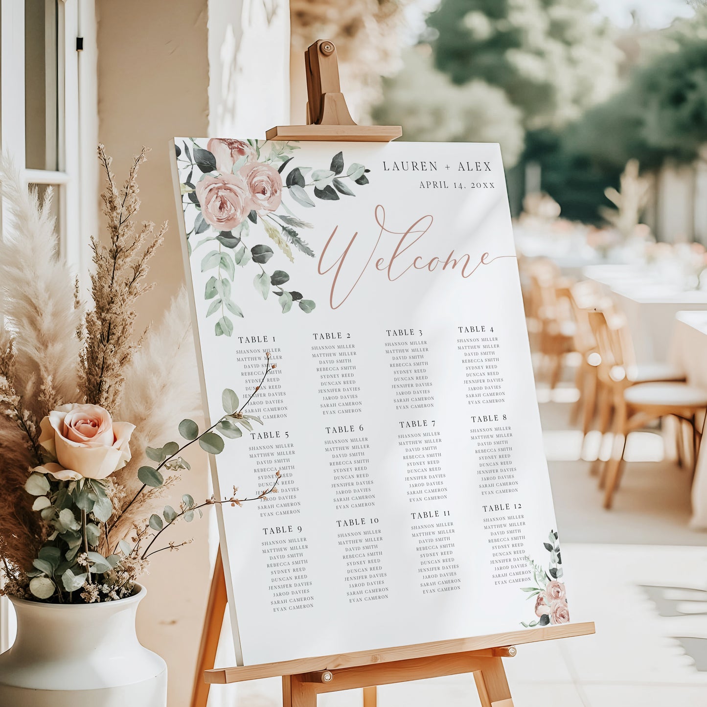 Blush pink floral and greenery wedding seating chart sign template with rose gold calligraphy welcome script and 12 table layout, editable in Canva