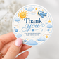 Editable here comes the son baby shower round thank you sticker Canva template with smiling sun, blue toy airplane, fluffy clouds, and gold and blue star accents on a cream background
