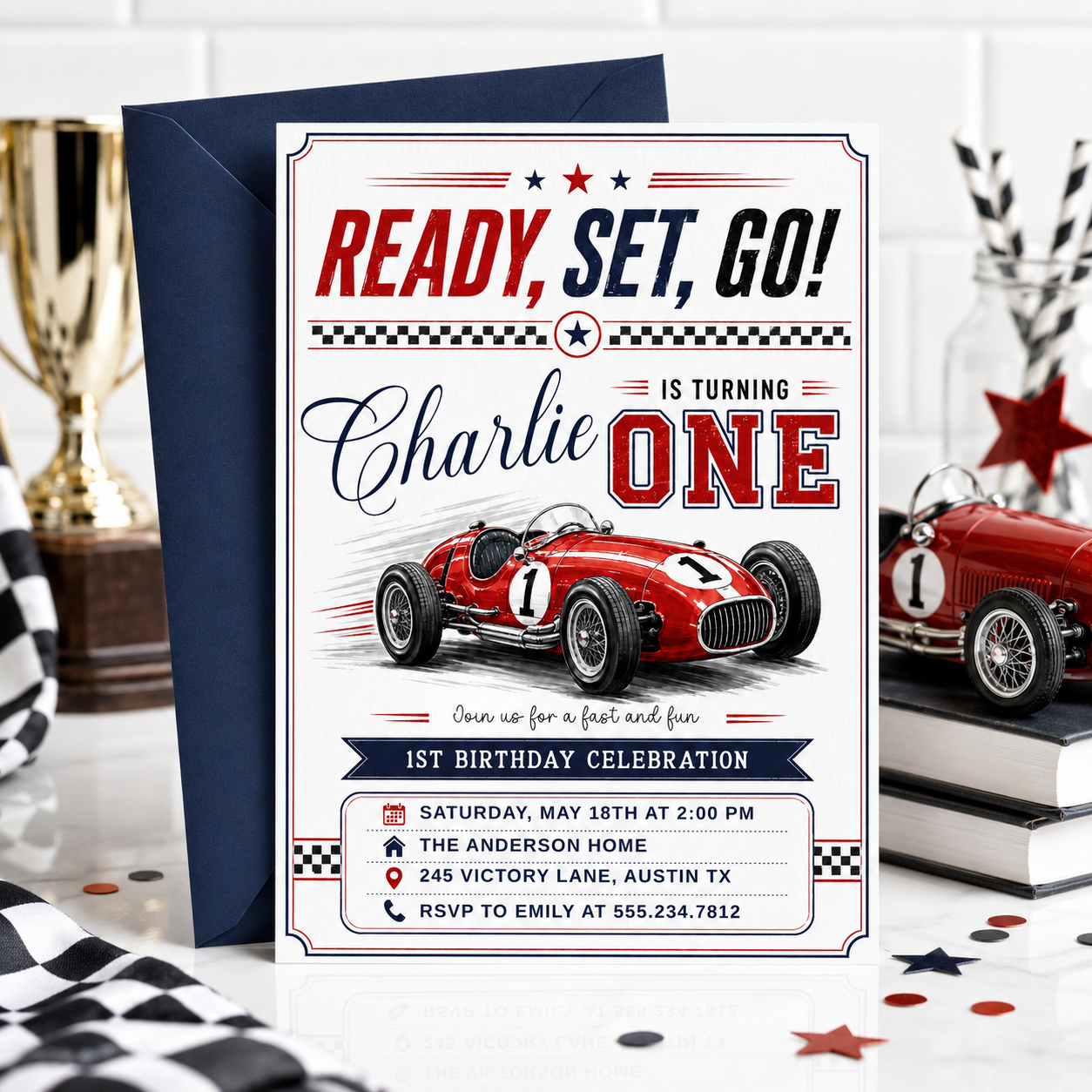 Race car first birthday invitation with red vintage race car, checkered flags, varsity ONE lettering, racing stripes, stars, and bold boys 1st birthday details