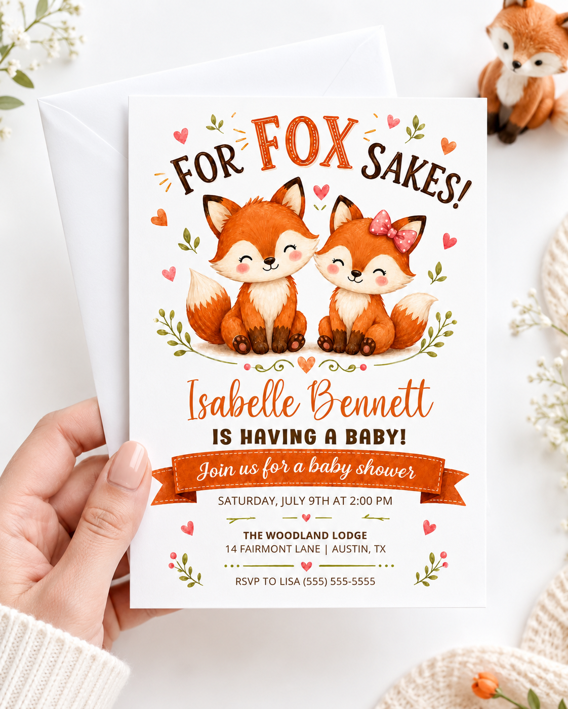 Fox baby shower invitation with two cute baby foxes, leafy greenery, hearts, orange banner, playful woodland details, and warm orange brown accents