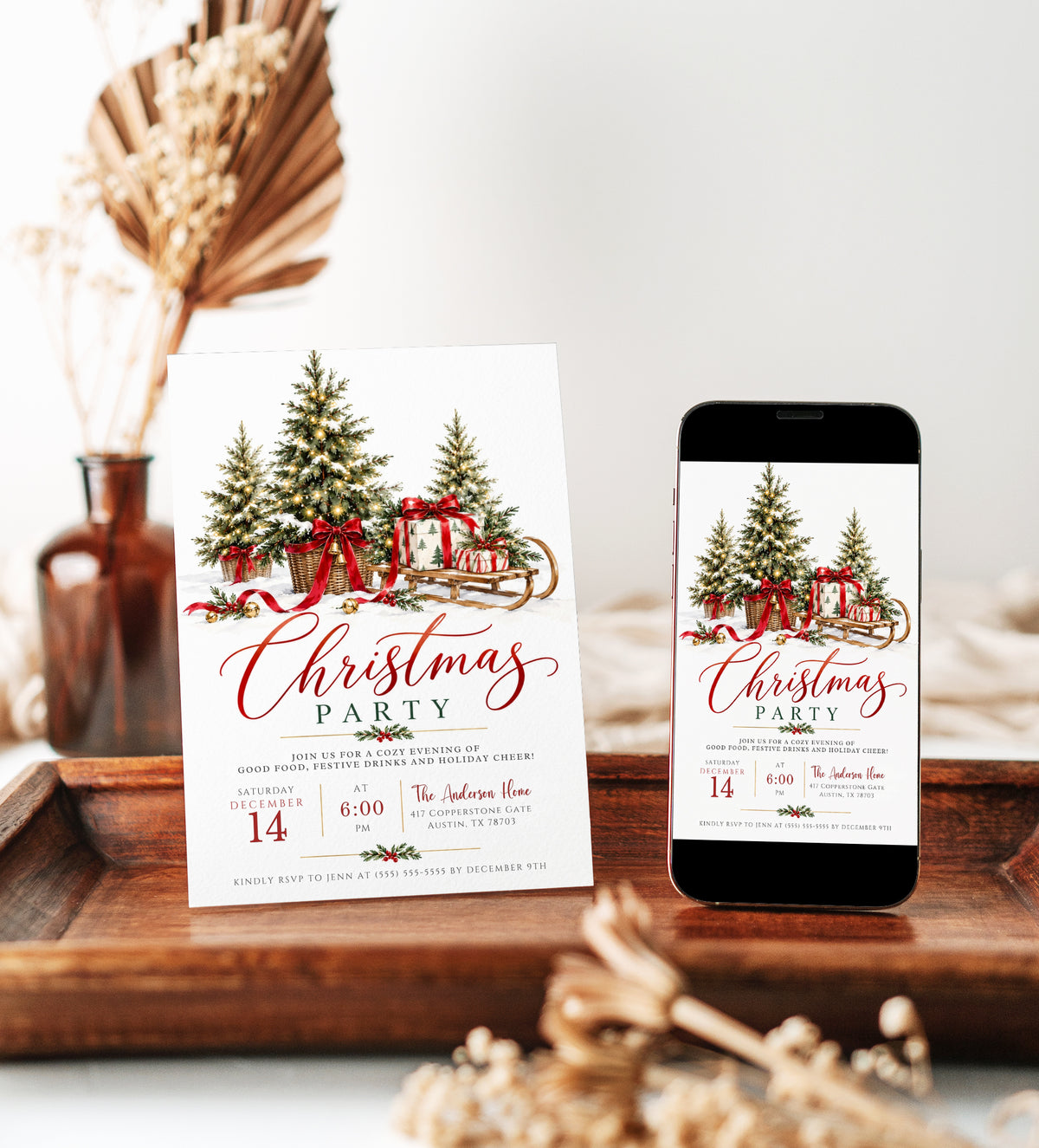 Christmas party invitation with three snow-dusted evergreen trees in wicker baskets, glowing string lights, red bows, gold bells, and a wooden sled carrying wrapped gifts