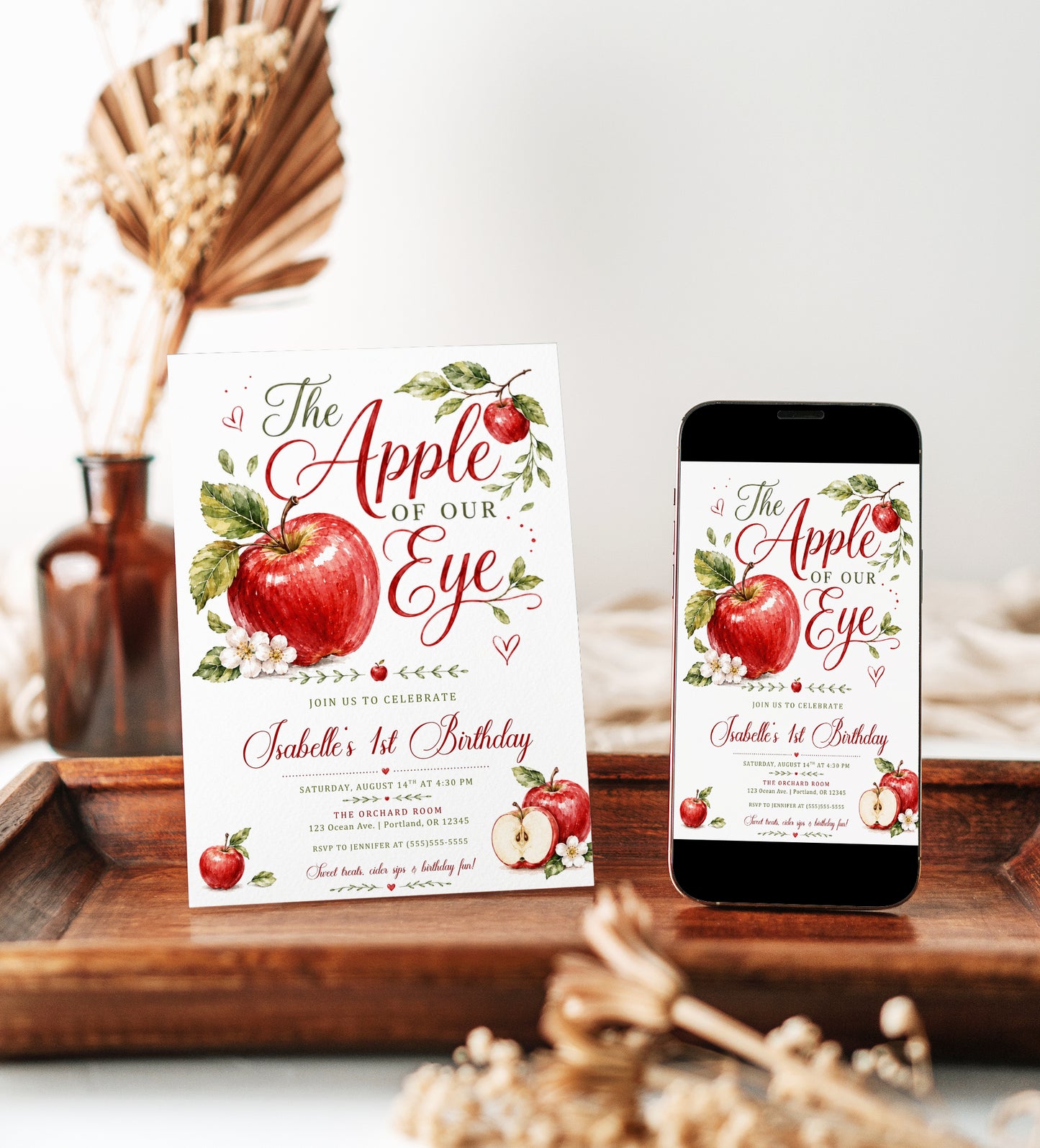 Apple of our eye birthday invitation with watercolor red apples, leafy branches, apple blossoms, hearts, elegant script lettering, and orchard birthday details
