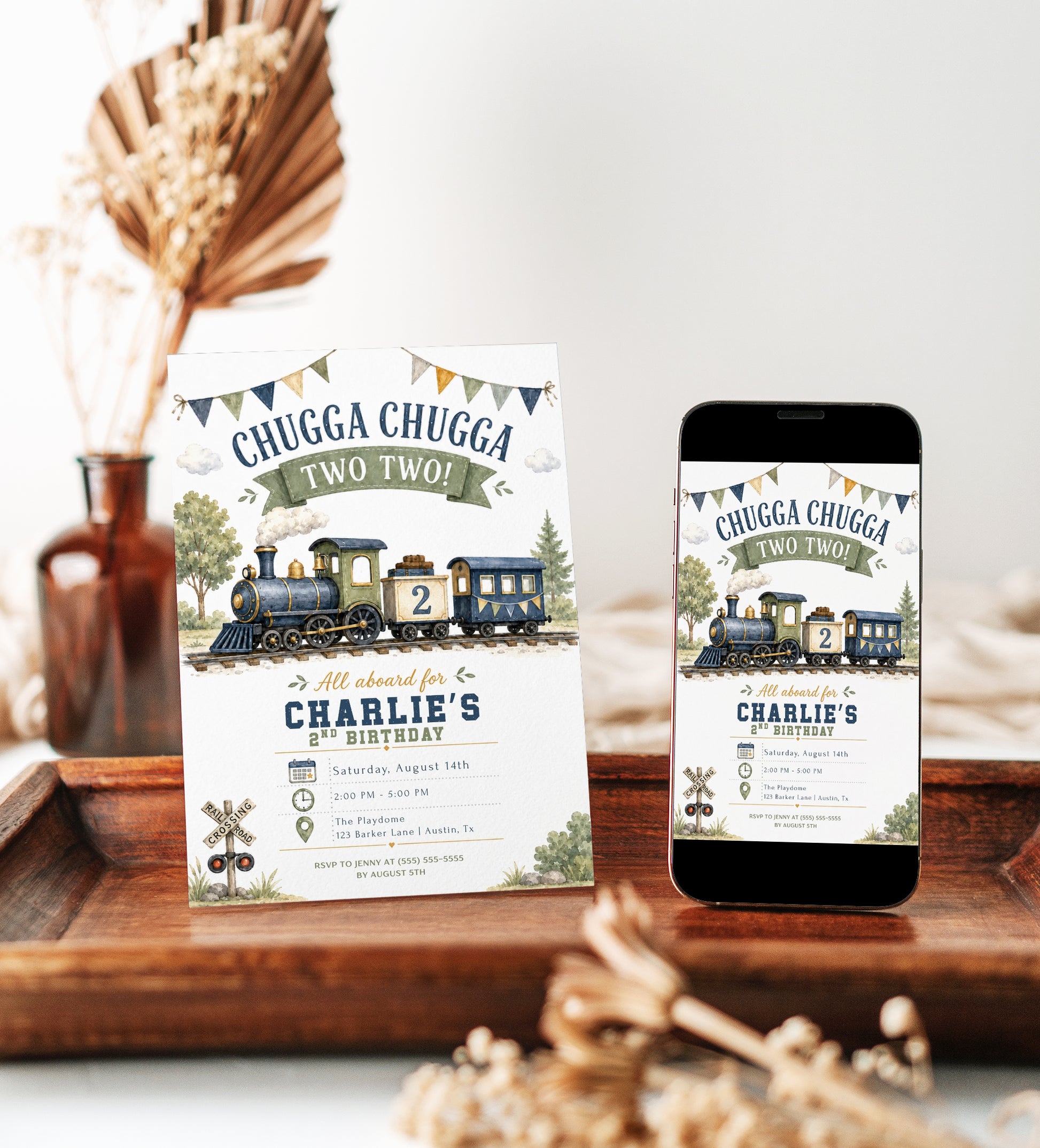 Chugga Chugga Two Two second birthday invitation featuring a navy and sage steam train, railroad crossing sign, trees and bunting.
