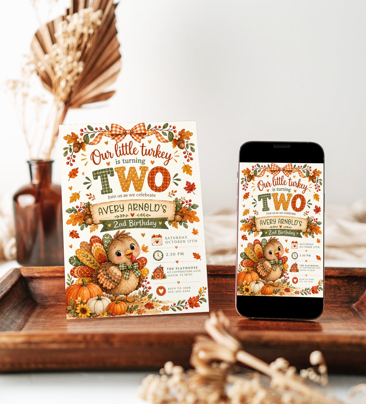Fall 2nd birthday invitation with Our Little Turkey Is Turning Two wording, a cute turkey, orange gingham bow, pumpkins, and autumn leaves
