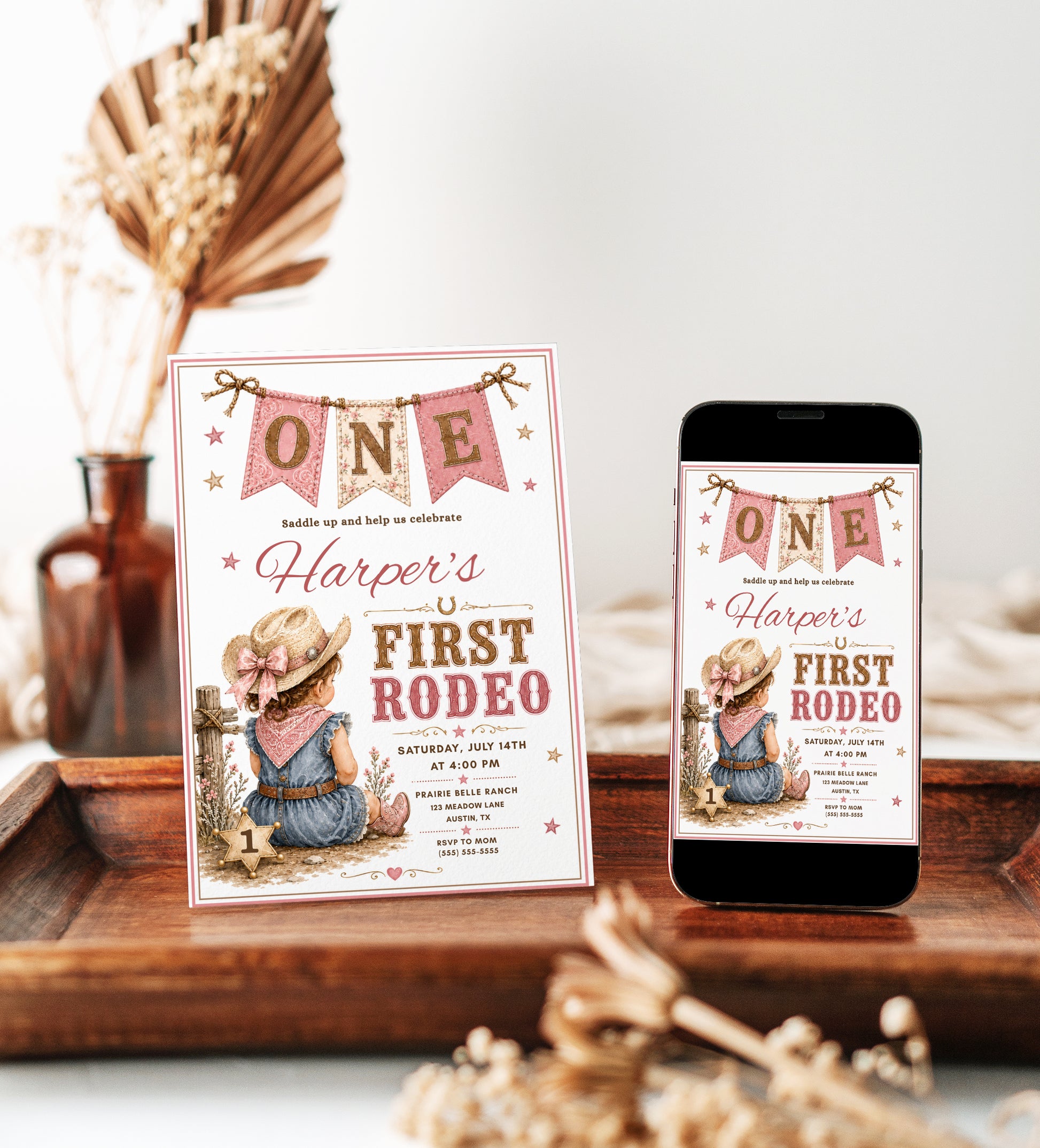 A rustic western-themed first birthday invitation card with an illustrated child at a rodeo.