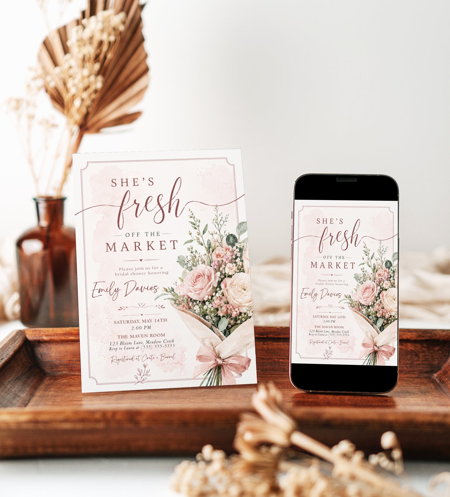 Editable fresh off the market bridal shower invitation Canva template with watercolour blush rose bouquet, baby's breath, eucalyptus, dusty rose bow, and script typography on a soft blush background with frame border