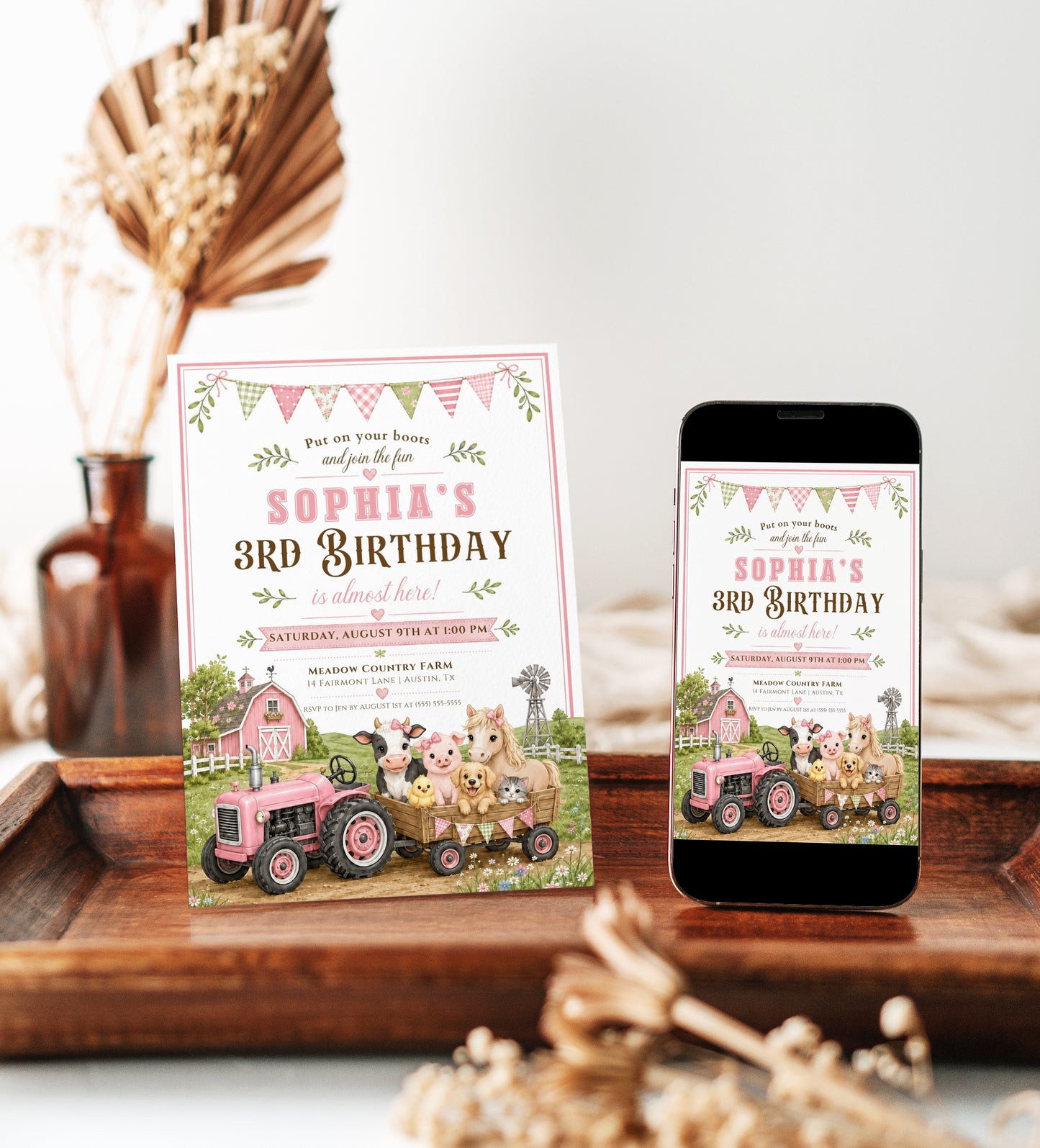 Girls farm birthday invitation featuring a pink tractor, pink barn, wagon, cow, pig, pony, chick and floral bunting.