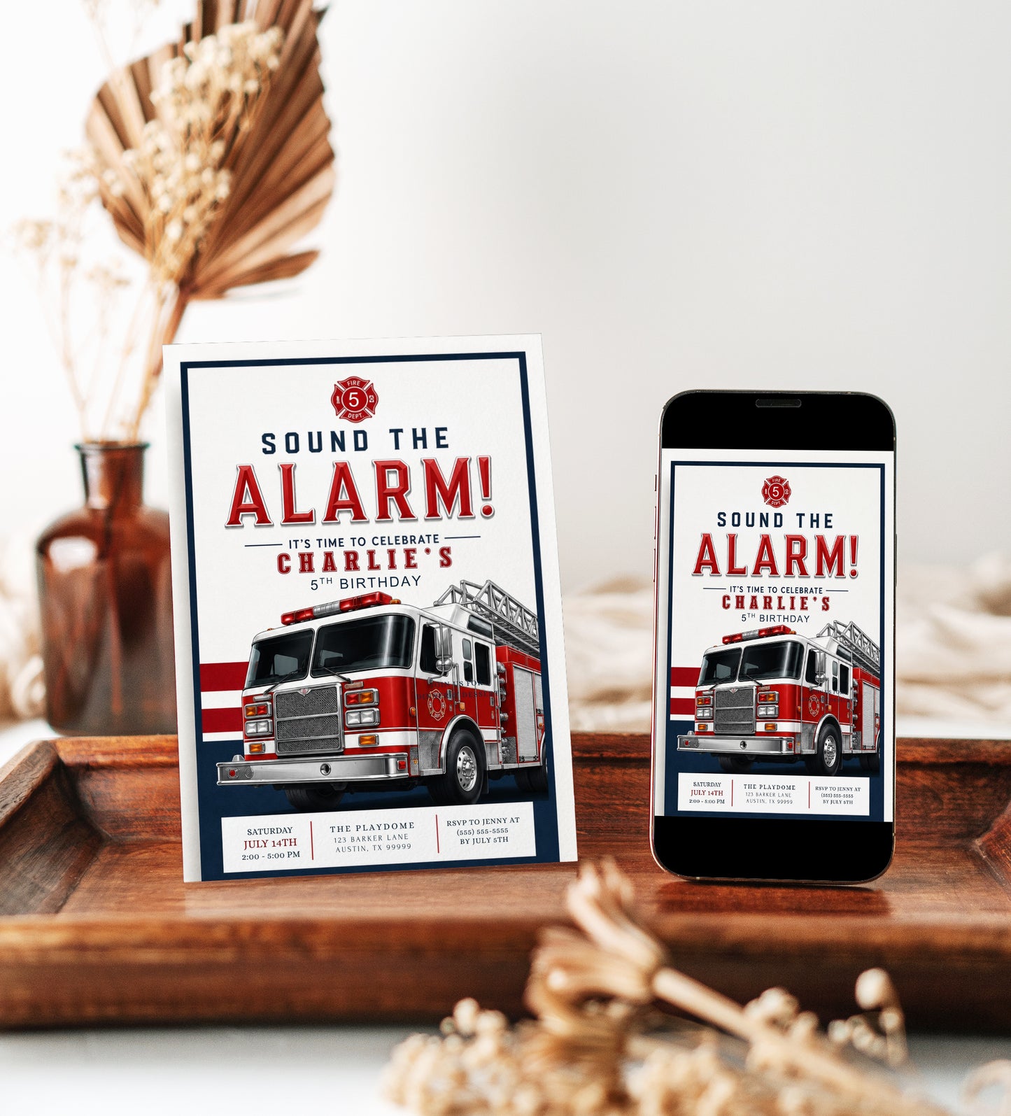 Sound the Alarm firetruck birthday invitation featuring a realistic red ladder fire engine with bold red, white and navy details.
