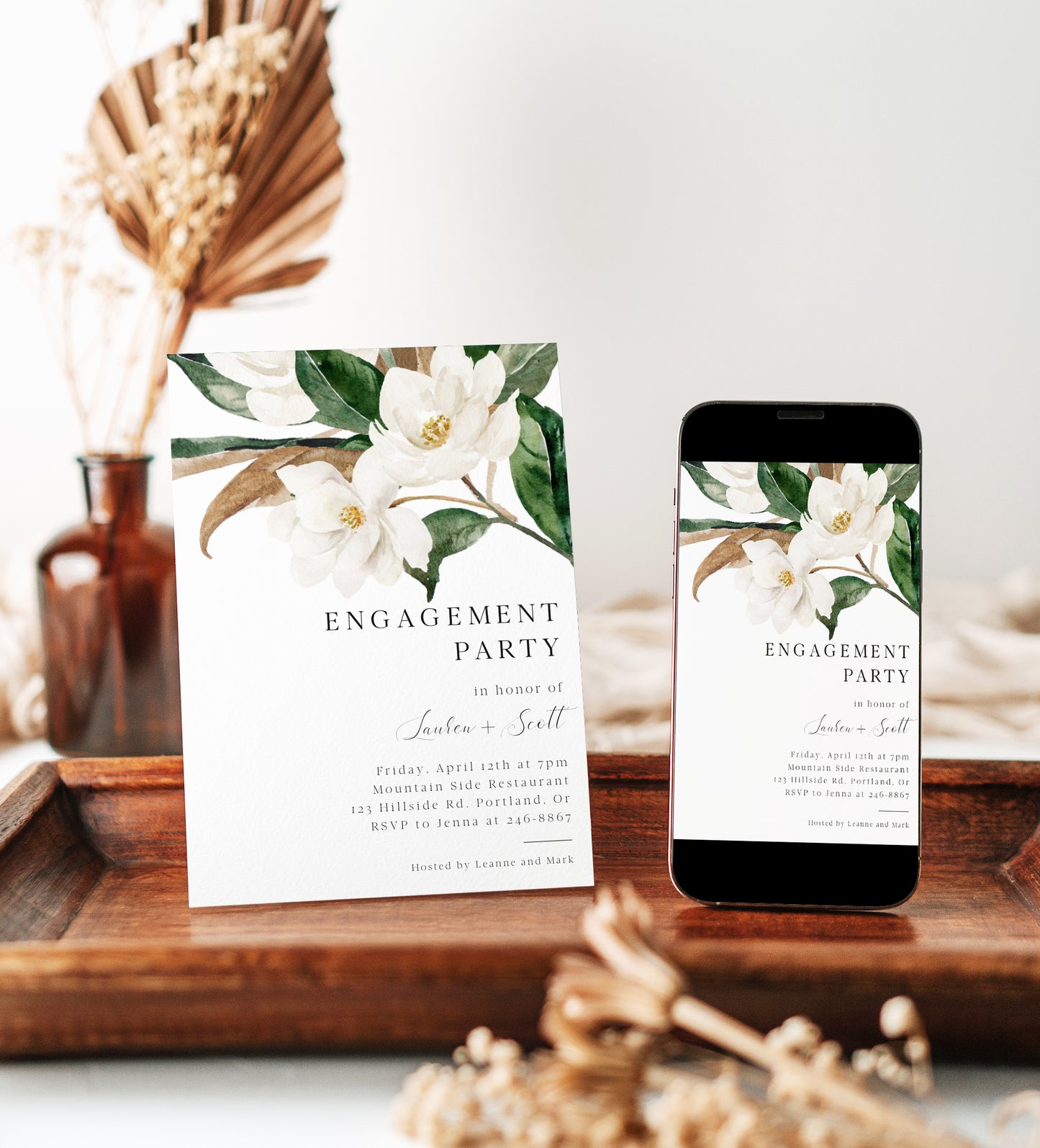 Editable white magnolia engagement party invitation Canva template with oversized watercolour magnolia blooms, deep green leaves, and bold spaced serif typography on a white background