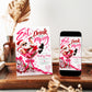 Christmas cocktail party invitation with Santa wearing sunglasses in a giant pink martini glass, disco ball ornaments, pink bows, and Eat Drink and Be Merry lettering