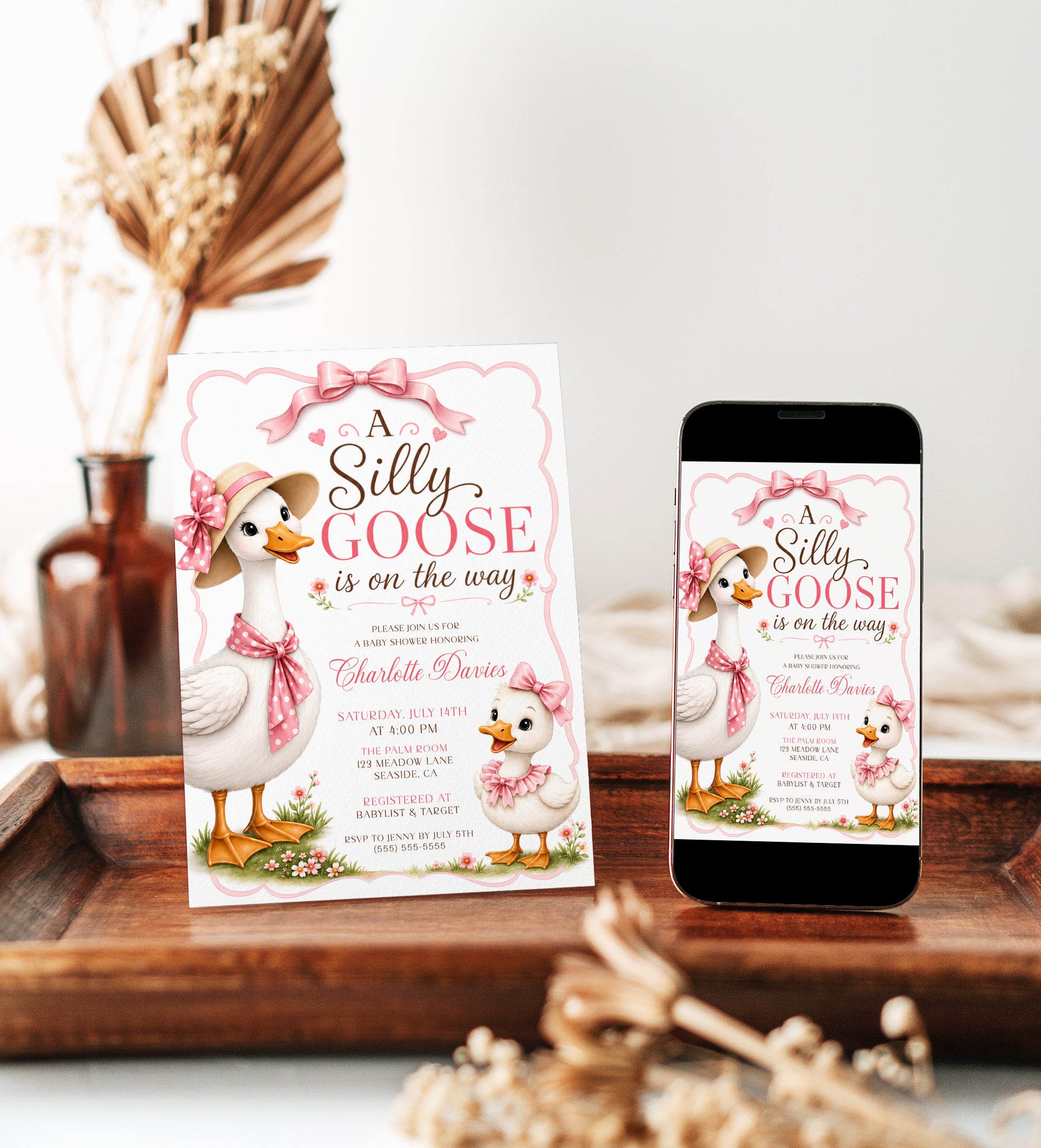 Editable silly goose baby shower invitation Canva template with illustrated mama goose in straw hat and polka dot bow, baby gosling with pink ruffle bow, wildflowers, and satin pink bow frame on a white background