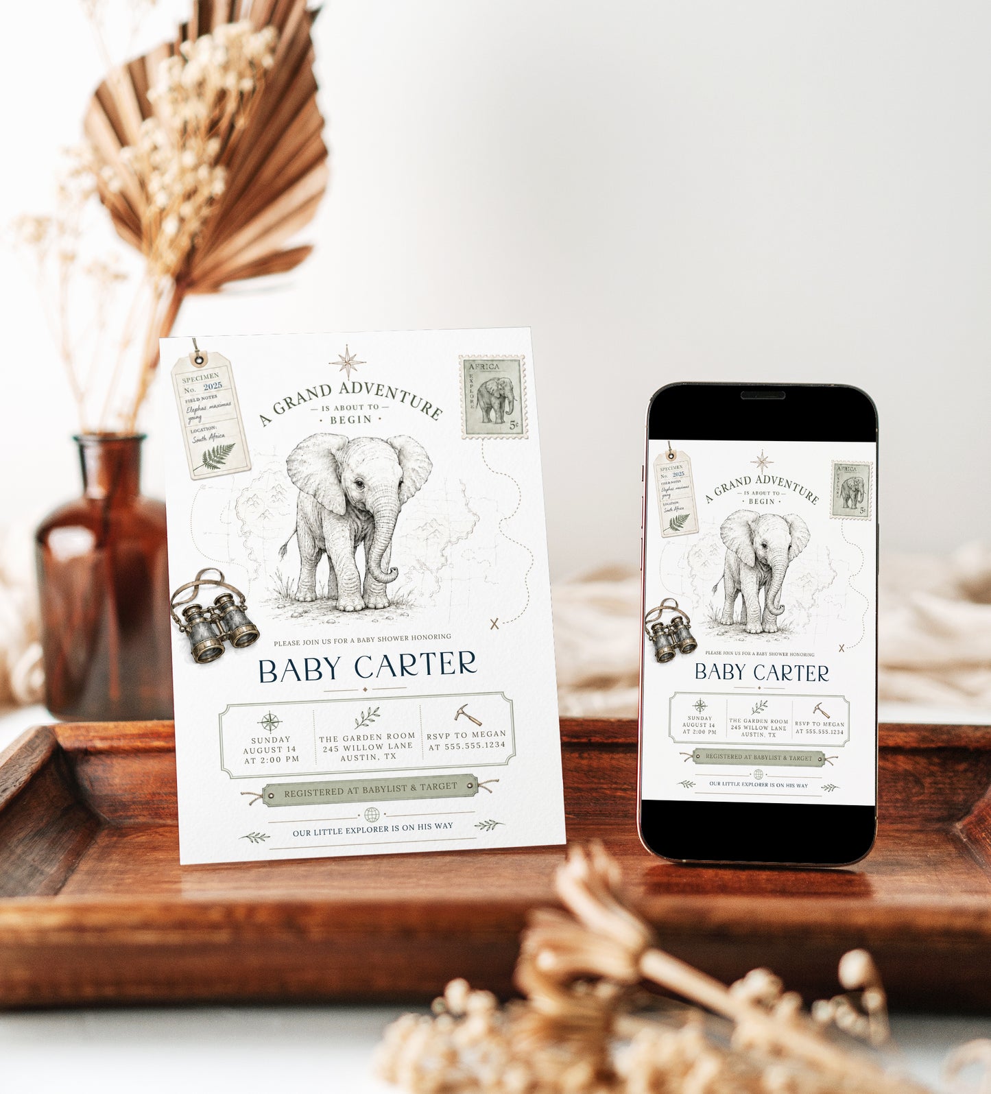 Grand adventure elephant baby shower invitation with baby elephant sketch, vintage binoculars, specimen tag, safari postage stamp, map details, and compass accents