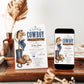 Editable hobby horse cowboy baby shower invitation Canva template with illustrated hobby horse, denim bandana bow, blue cowboy boots, tan hat, horseshoe, and bronze star with bold navy distressed typography on a cream background