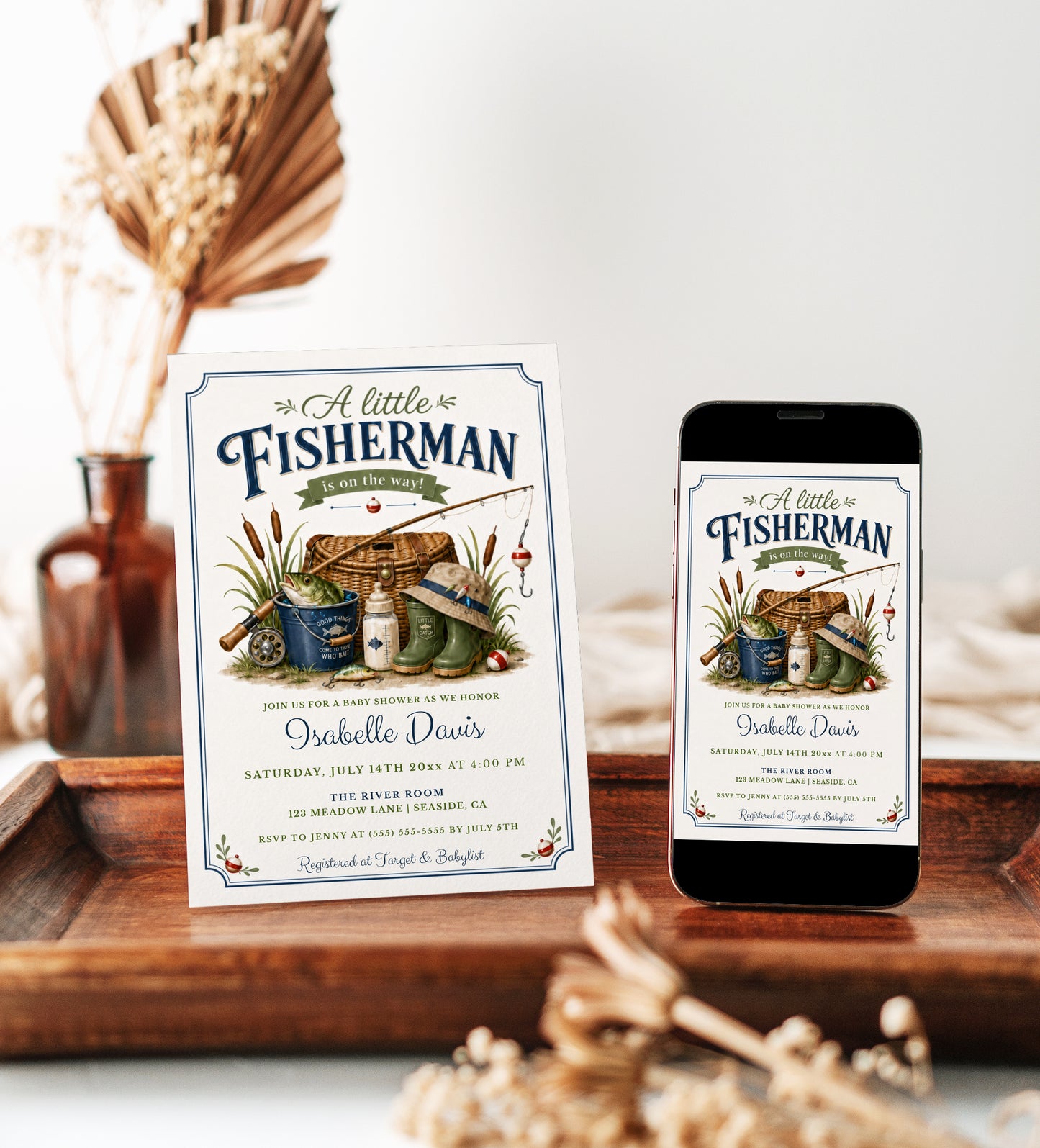 Little fisherman baby shower invitation with fishing gear, a creel basket, and green boots in navy and green