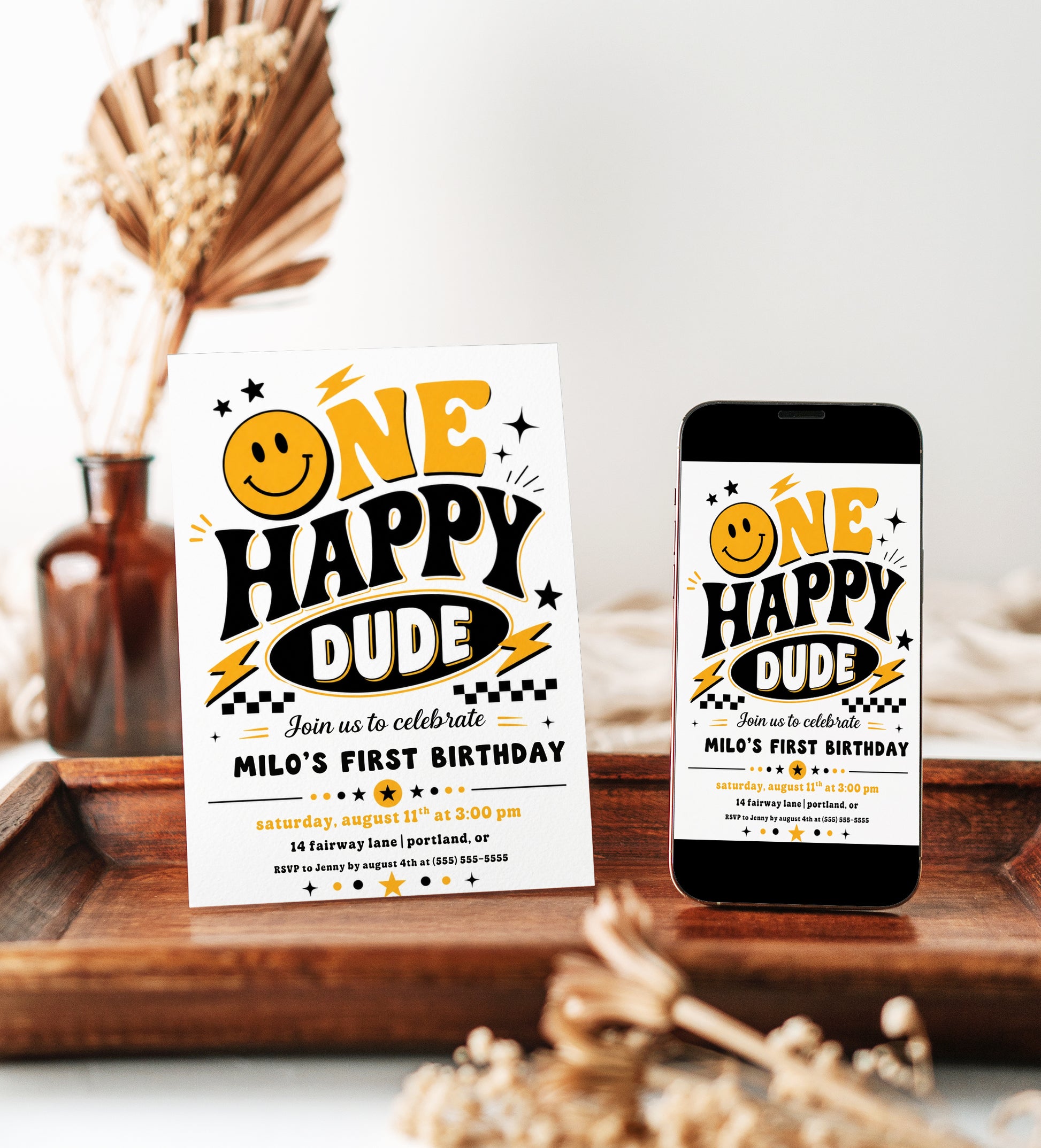 One Happy Dude first birthday invitation with retro smiley face, yellow and black lettering, lightning bolts, stars, and checkerboard birthday party details