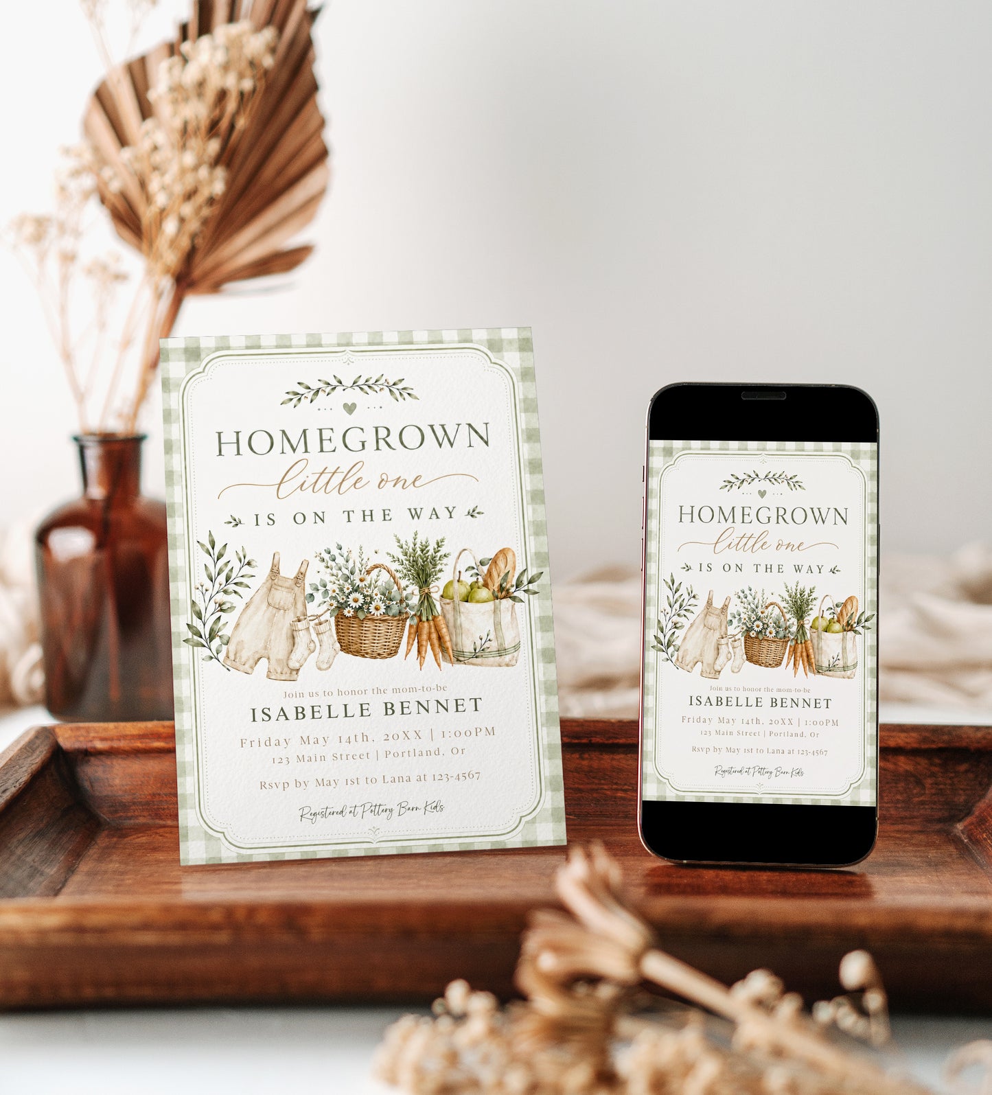 Editable homegrown baby shower invitation Canva template with watercolour baby overalls, daisy basket, carrots, market tote, sage gingham background, and olive branch accents