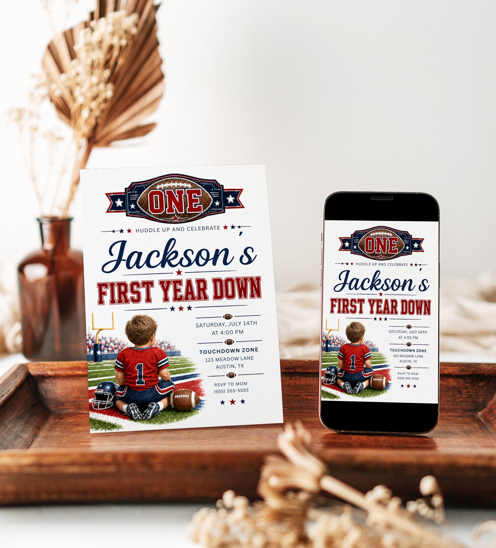 First Year Down first birthday invitation with little football player, stadium field, helmet, football, and red navy sports birthday party details