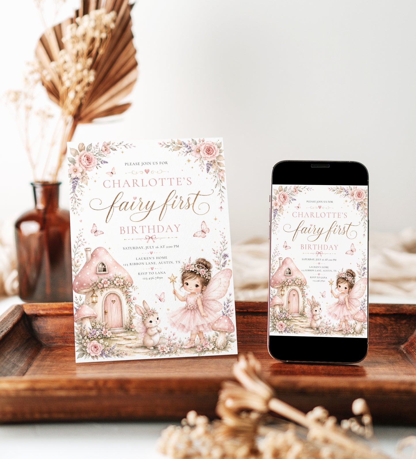 Fairy first birthday invitation with pink fairy, mushroom cottage, butterflies, flowers, bunny, and whimsical woodland birthday party details