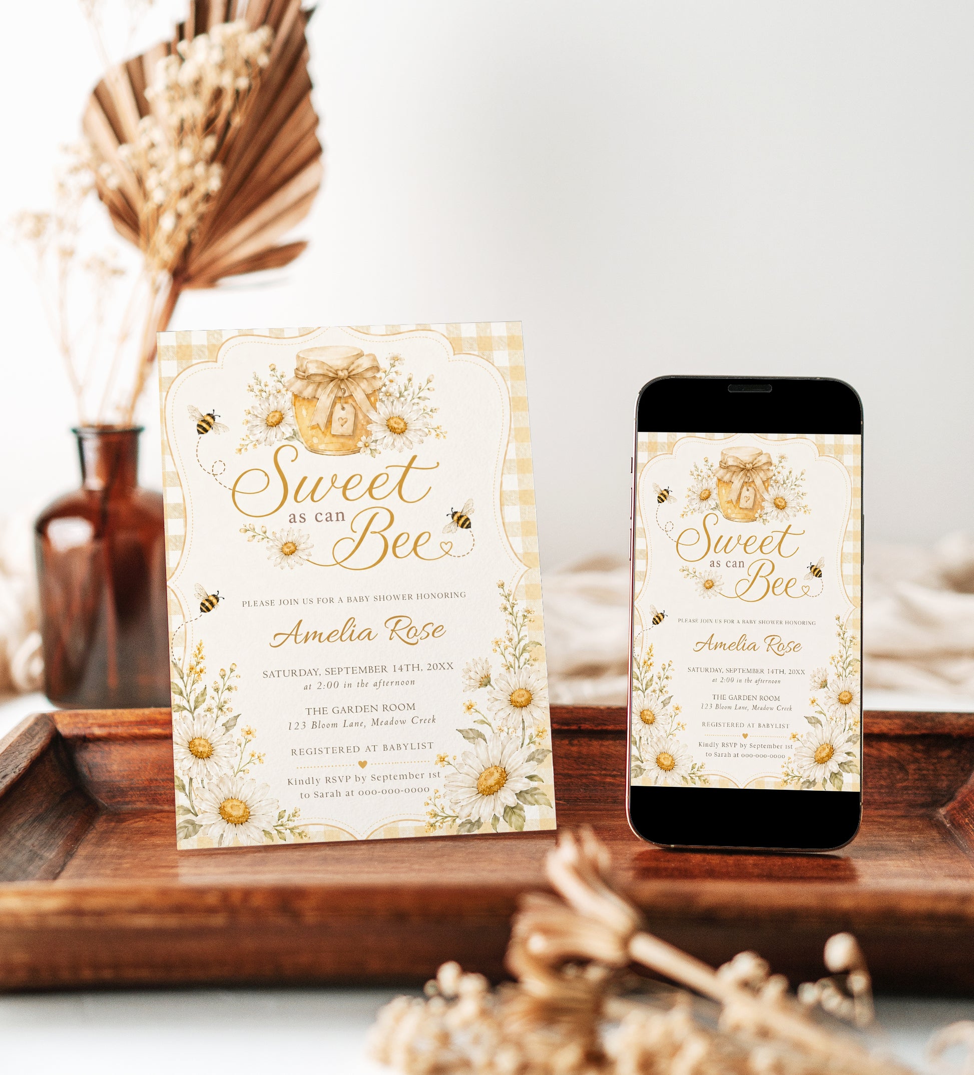 Editable sweet as can bee baby shower invitation Canva template with watercolour honey jar, white daisies, bumble bees, and gold script typography on a butter yellow gingham background