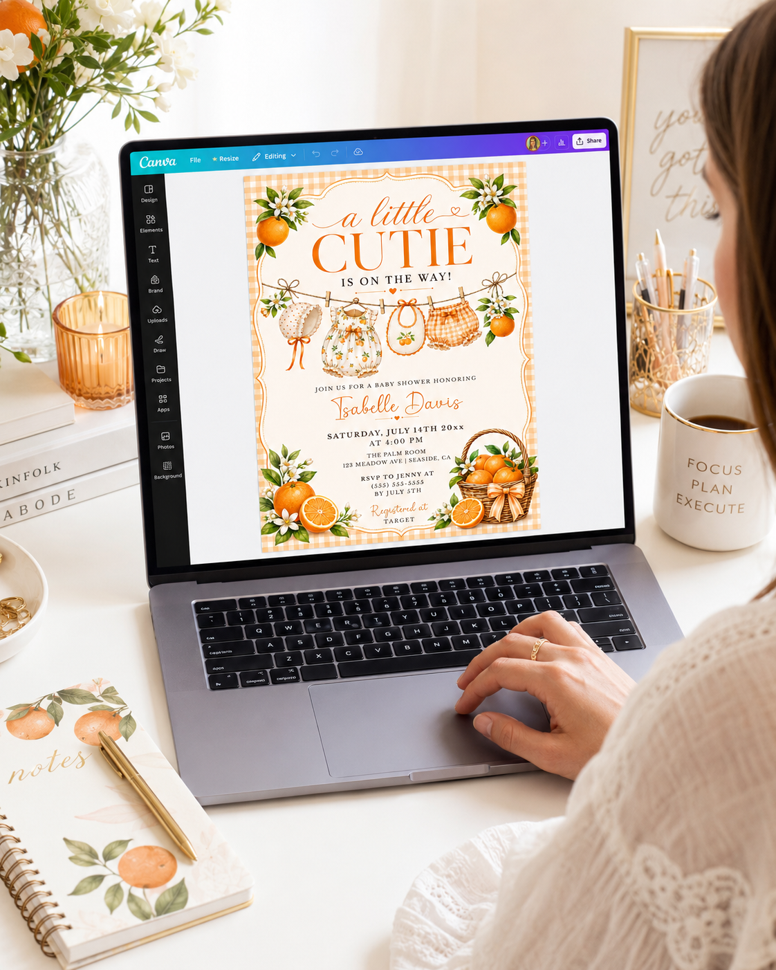 Editable little cutie baby shower invitation Canva template with watercolour oranges, orange blossoms, wicker fruit basket, clothesline scene with romper and bonnet, and orange gingham background