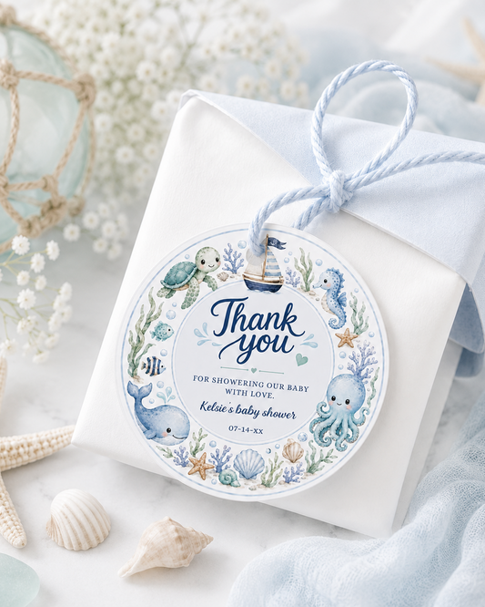 Editable under the sea baby shower round thank you sticker Canva template with watercolour sea turtle, whale, octopus, seahorse, sailboat, coral, shells, and starfish wreath in soft blue tones on a white background
