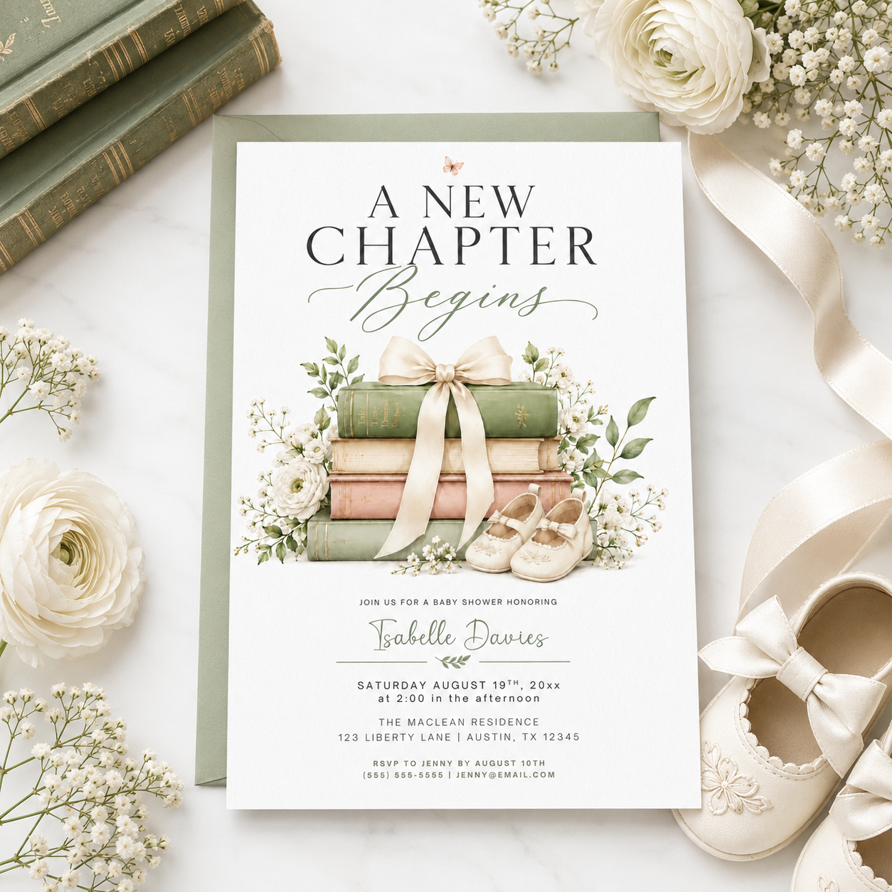 Editable a new chapter baby shower invitation Canva template with stacked vintage hardcover books tied with cream bow, baby shoes, white ranunculus, baby's breath, and botanical greenery on a white background