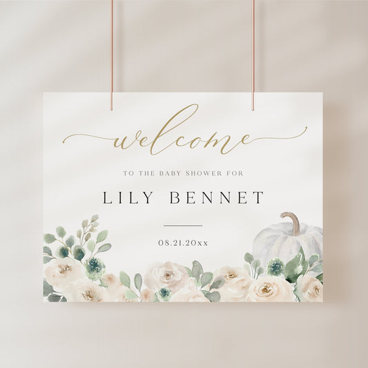 White pumpkin floral baby shower welcome sign template with watercolor roses, sage greenery, and gold calligraphy script, editable in Canva
