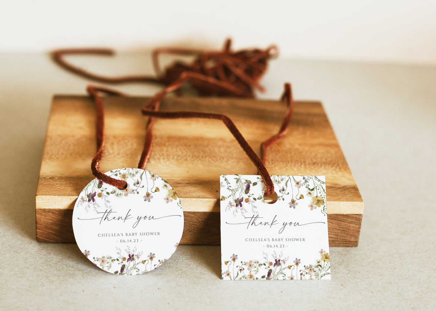 Wildflower baby shower thank you gift tag template with watercolor meadow flowers in yellow, purple, and cream, editable in Canva