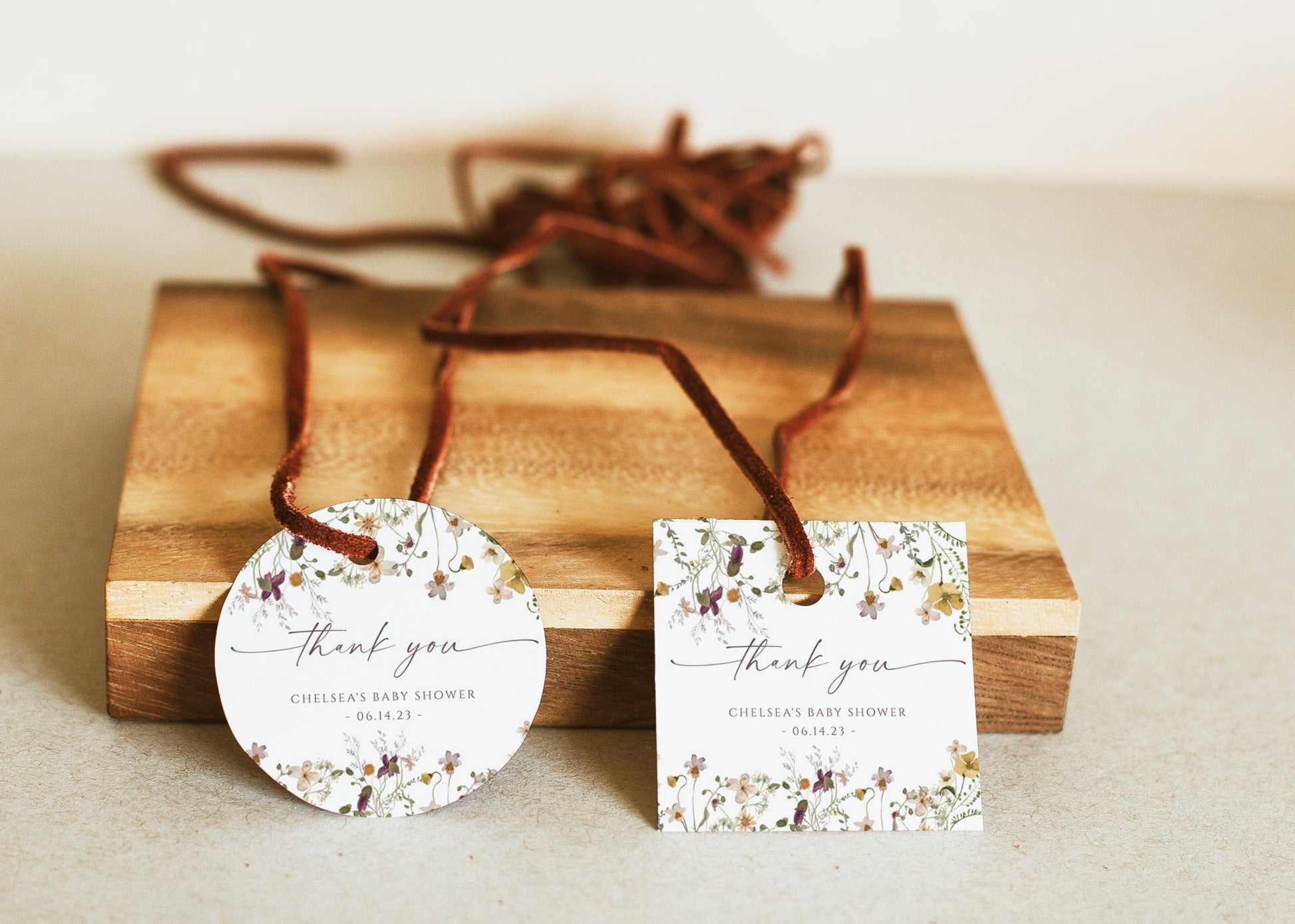 Wildflower baby shower thank you gift tag template with watercolor meadow flowers in yellow, purple, and cream, editable in Canva