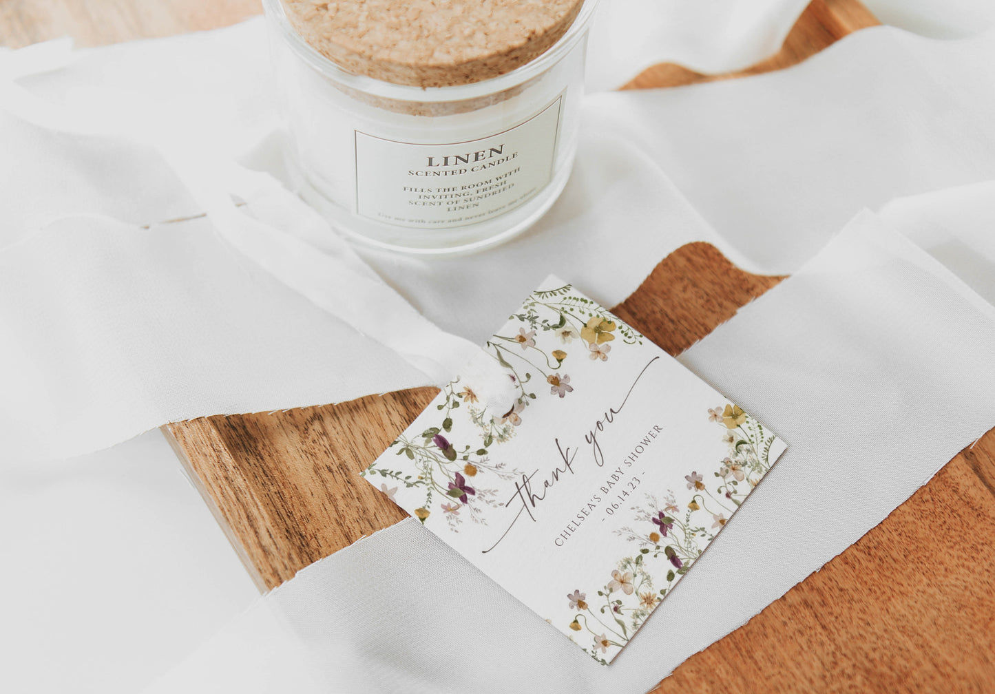 Wildflower baby shower thank you gift tag template with watercolor meadow flowers in yellow, purple, and cream, editable in Canva