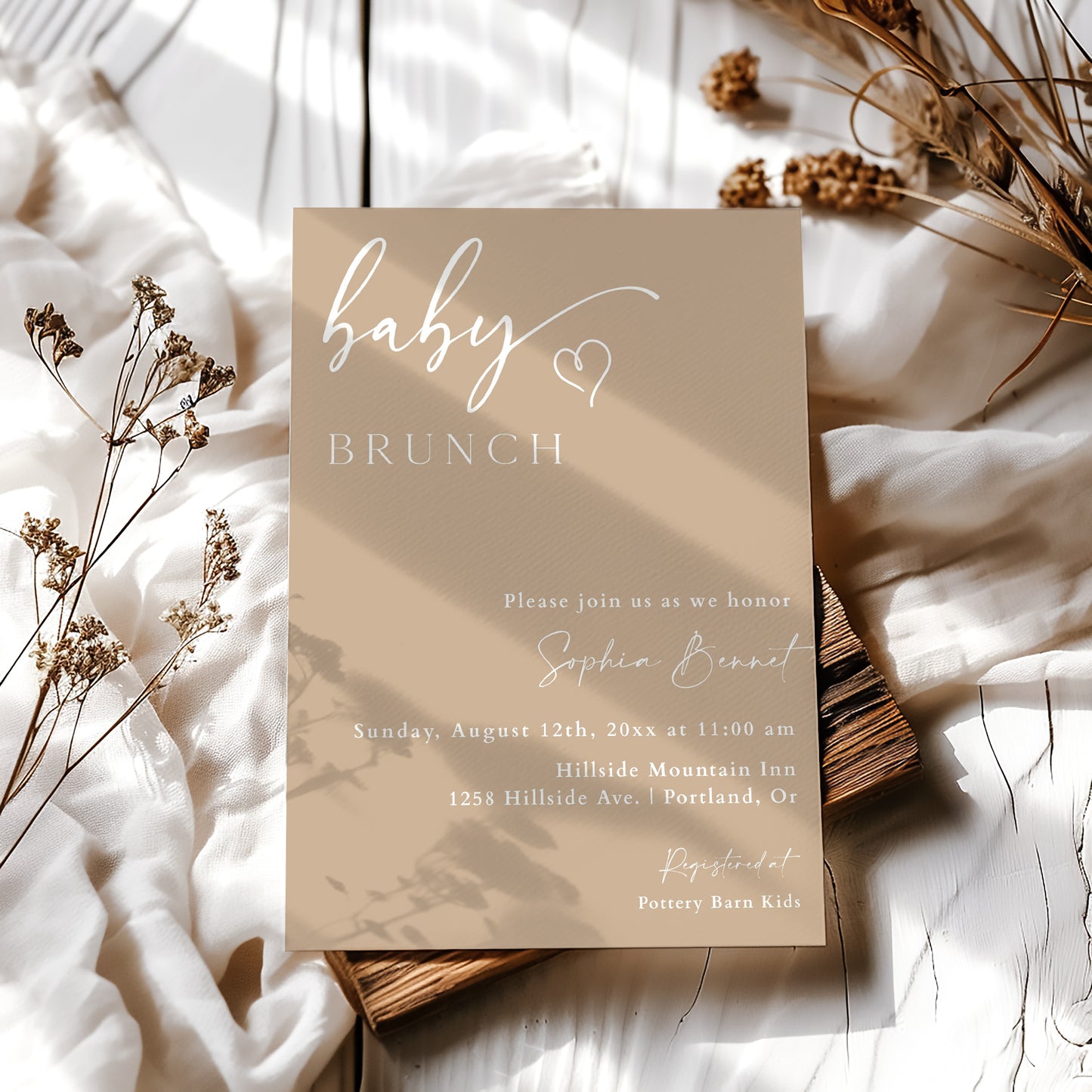 Minimalist baby brunch invitation template with warm beige background and white script typography, editable in Canva