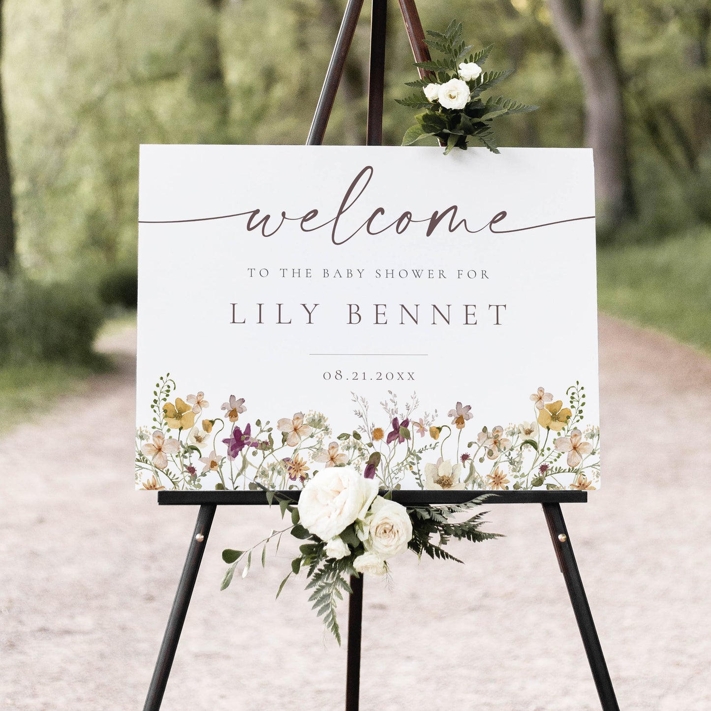 Horizontal wildflower baby shower welcome sign template with watercolor meadow flowers in yellow, purple, and cream, editable in Canva