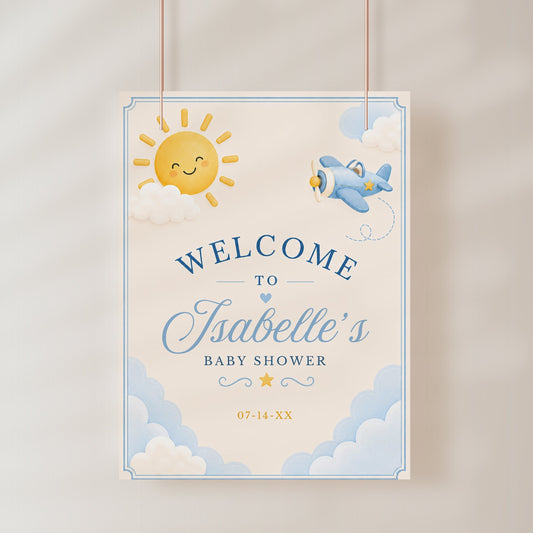 Editable here comes the son baby shower welcome sign Canva template with smiling sun, blue toy airplane, fluffy clouds, arched navy typography, and flowing script on a warm cream background