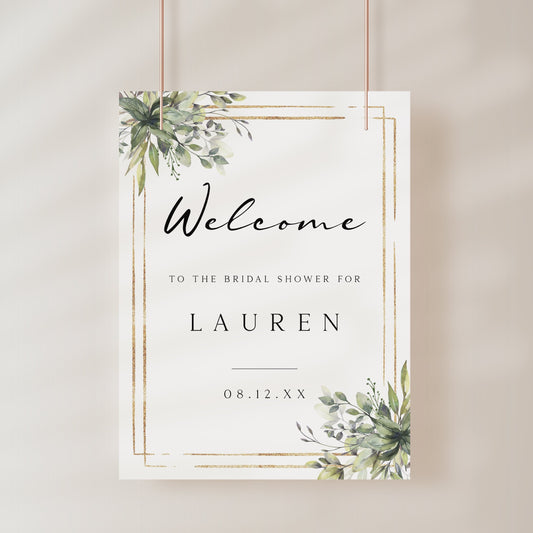 Eucalyptus greenery and gold frame bridal shower welcome sign template with watercolor botanicals in corner clusters, editable in Canva