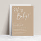 Editable neutral oh baby baby shower invitation Canva template with oversized script typography and hand-drawn heart on a warm sand beige background