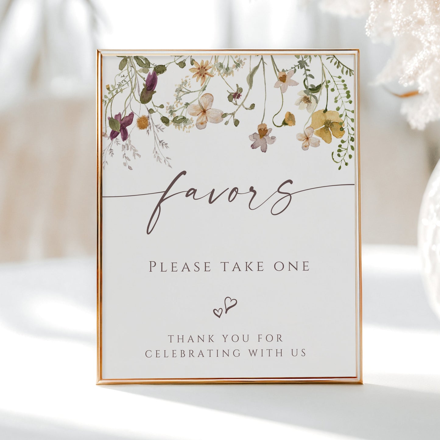 Wildflower baby shower favors sign template with watercolor meadow flowers in yellow, purple, and cream with calligraphy script, editable in Canva