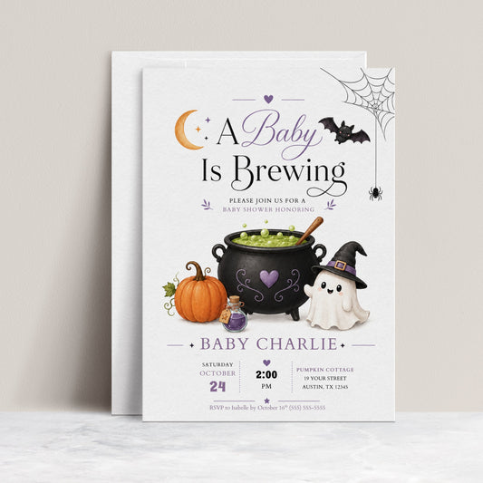 A Baby Is Brewing baby shower invitation with bubbling cauldron, pumpkin, potion bottle, ghost in witch hat, bat, crescent moon, and Halloween baby shower details