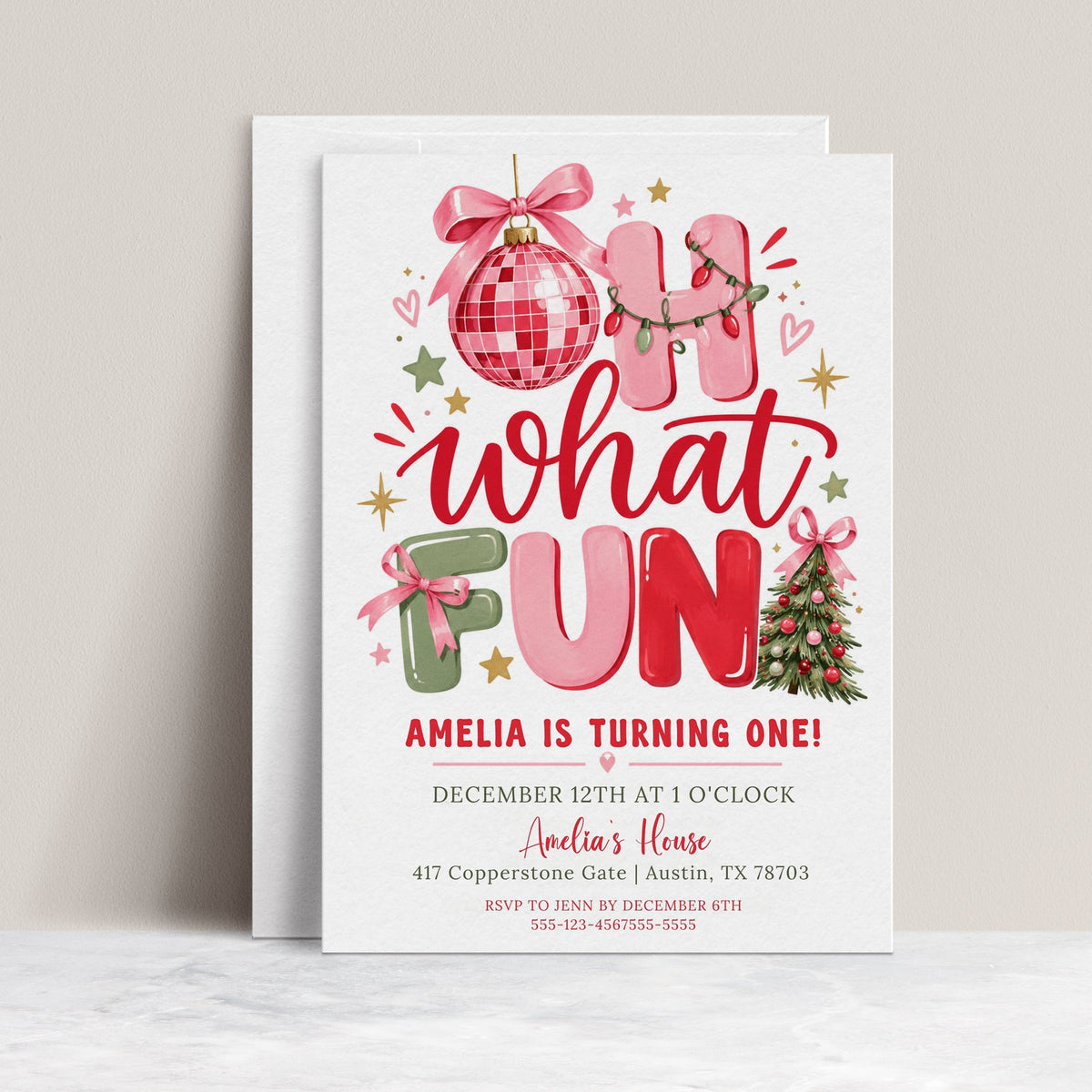 Christmas 1st birthday invitation with pink, red, and sage Oh What Fun lettering, a pink disco ornament, ribbon bows, Christmas lights, and a decorated tree
