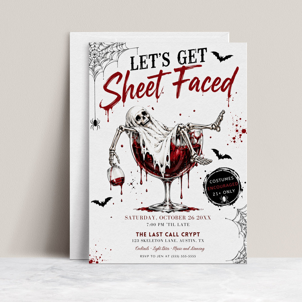 Adult Halloween party invitation with Let’s Get Sheet Faced headline, ghostly skeleton in a red cocktail glass, bats, and spiderwebs