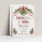 Christmas bridal shower invitation with pink satin bows, mistletoe, evergreen branches, gold bells and MISStletoe to Mrs lettering