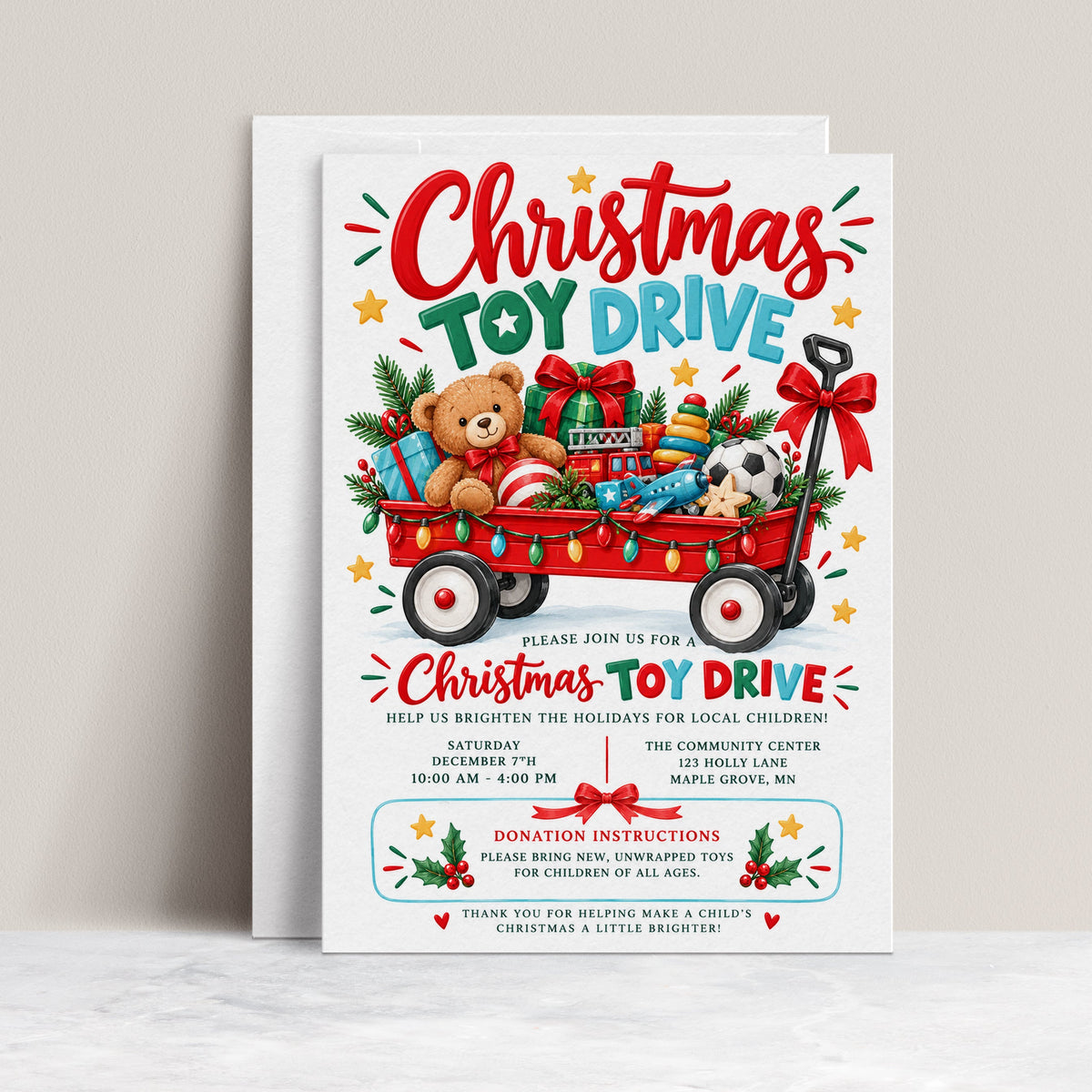 Christmas toy drive invitation with a red wagon filled with wrapped gifts, teddy bear, toy fire truck, colorful lights and festive holiday greenery