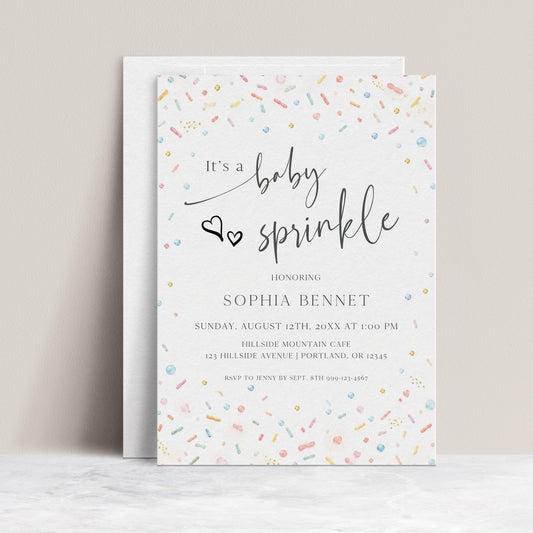 Editable confetti baby sprinkle invitation Canva template with watercolour sprinkles and pearl dots in soft rainbow tones on a white background, with script and serif typography