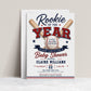 Rookie baseball baby shower invitation with crossed baseball bats, baseball, varsity lettering, navy ribbon banner, red and blue stars, and classic sports shower details