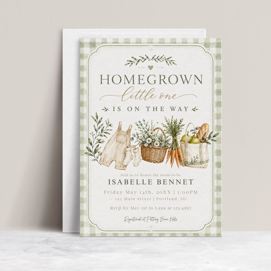 Editable homegrown baby shower invitation Canva template with watercolour baby overalls, daisy basket, carrots, market tote, sage gingham background, and olive branch accents