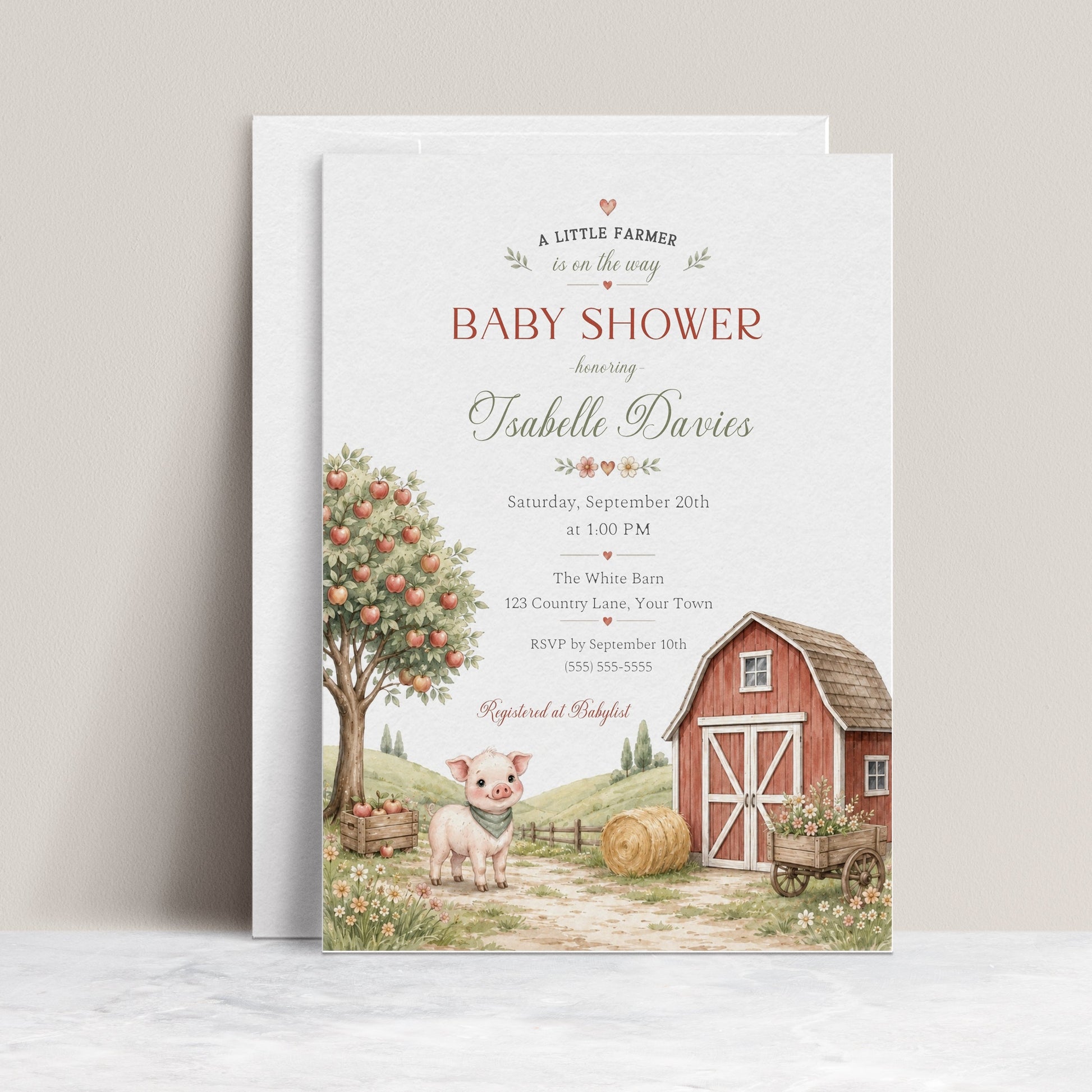 Little farm baby shower invitation with red barn, apple tree, piglet, hay bale, flower cart, rolling hills, fence, wildflowers, and soft farmhouse details