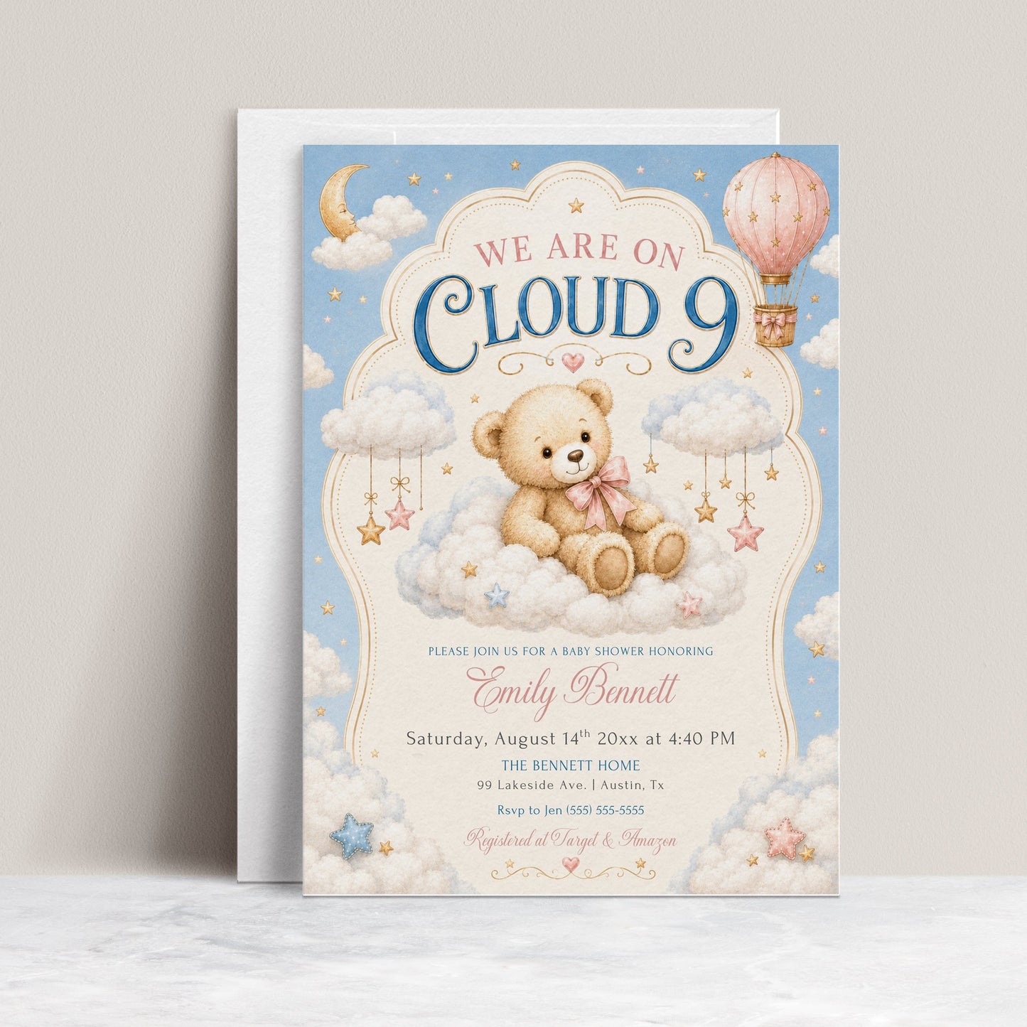 Cloud 9 baby shower invitation with a teddy bear on a cloud, hot air balloon, and stars in soft blue, pink, and gold