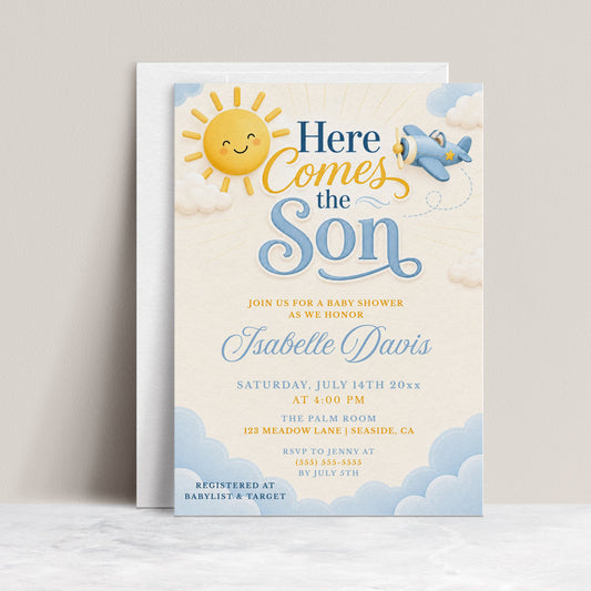 Editable here comes the son baby shower invitation Canva template with smiling sun, blue toy airplane, fluffy clouds, and bold navy and sky blue typography on a soft cream background, shown as a flat lay mockup