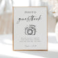 Minimalist black and white wedding photo guestbook sign template with calligraphy script and hand-drawn camera illustration, editable in Canva