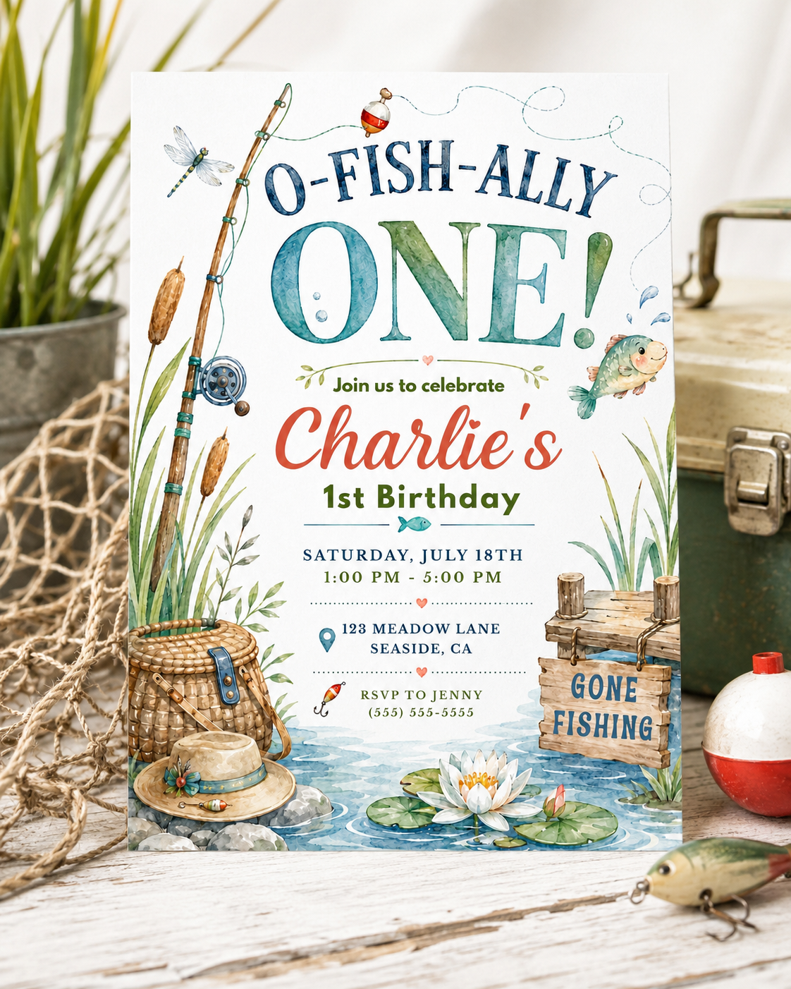 Fishing first birthday invitation with fishing pole, bobber, fish, basket, straw hat, lily pads, water, cattails, and rustic gone fishing sign